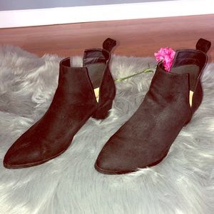 Women’s black booties.